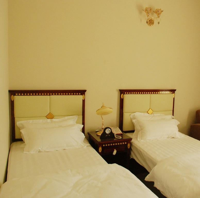 City Hotel Салалах Стая снимка