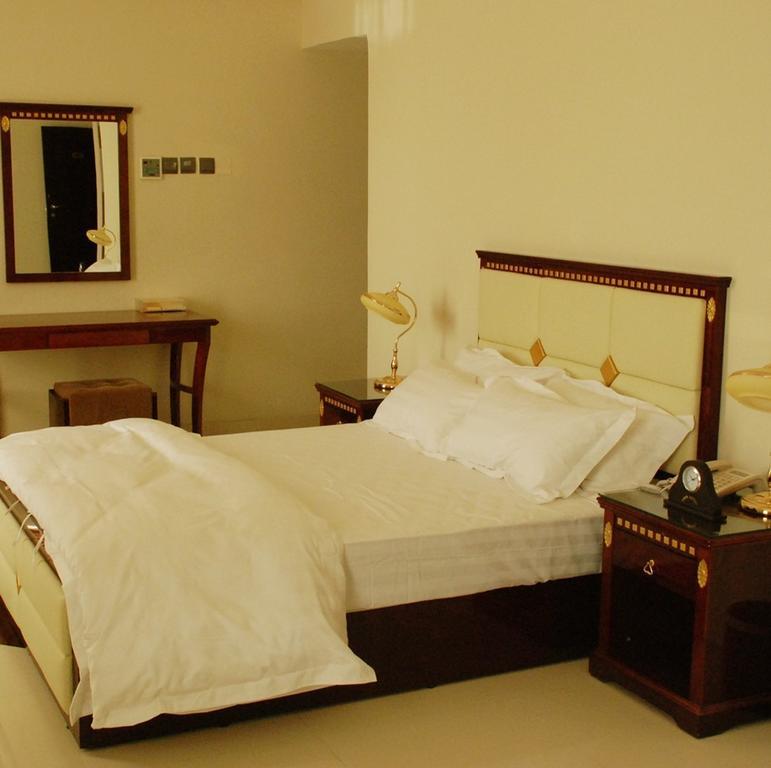City Hotel Салалах Стая снимка