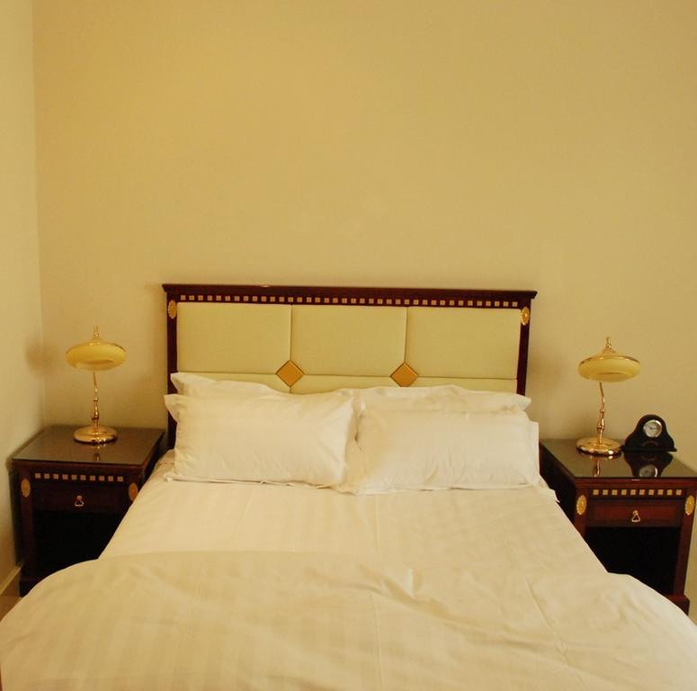 City Hotel Салалах Стая снимка